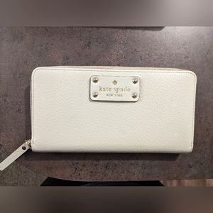 Kate Spade cream zip-around wallet